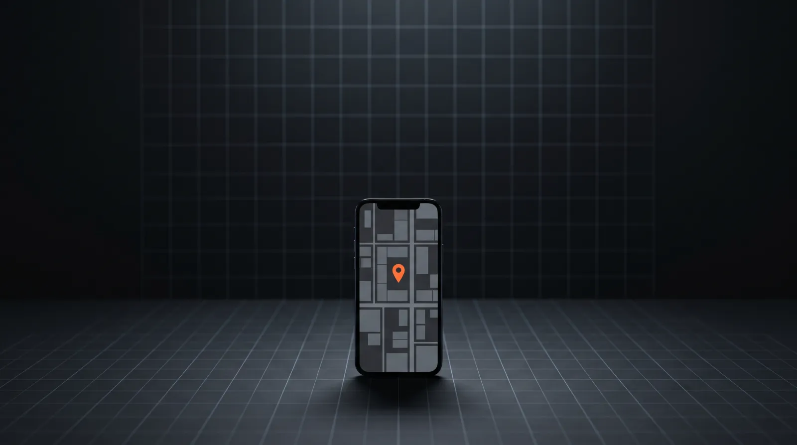A phone standing on a dark grid floor showing a simple map with an orange location pin